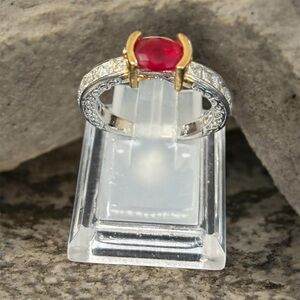 Elegant Gold and Silver Ring with Red Gemstone